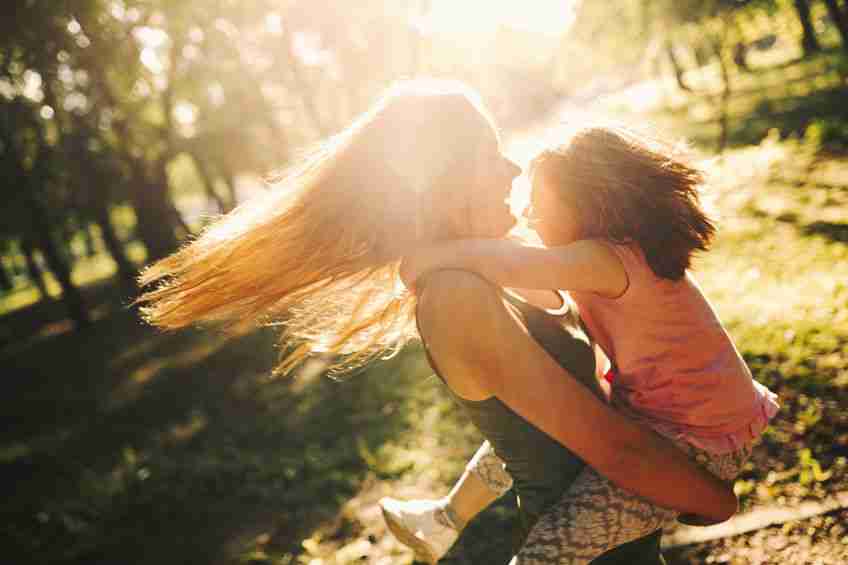 Little girl with special needs enjoy spending time with mother in nature